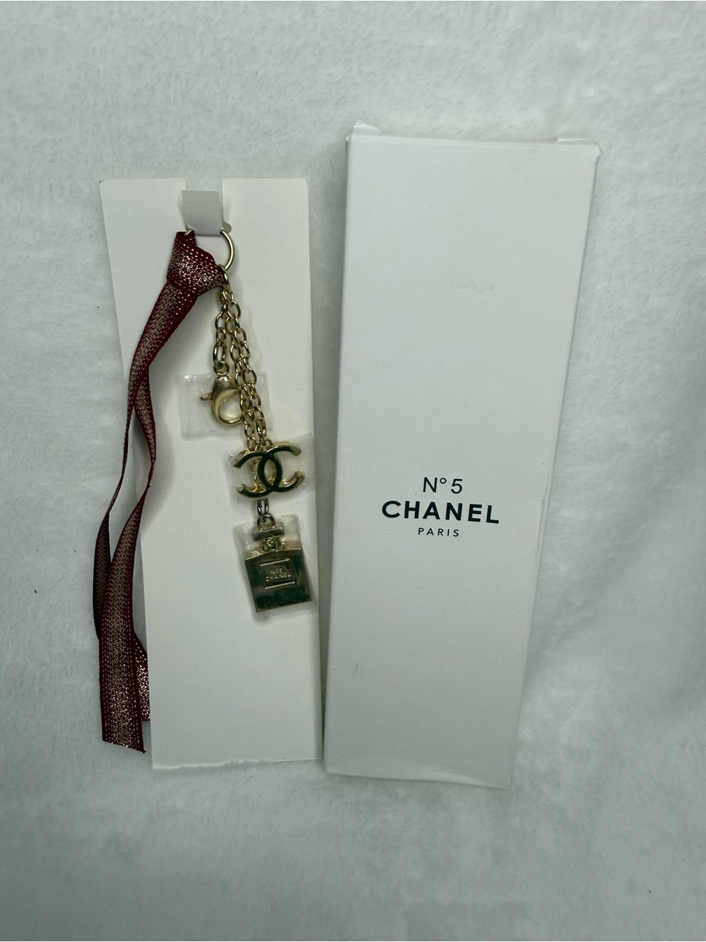 CHANEL Gold-Tone N°5 Charm Keychain with Burgundy Ribbon